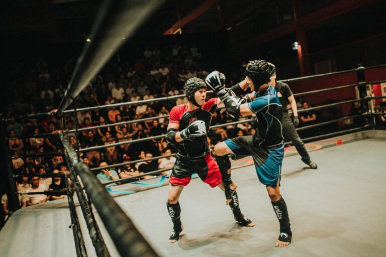 blue and red kick boxing in ring