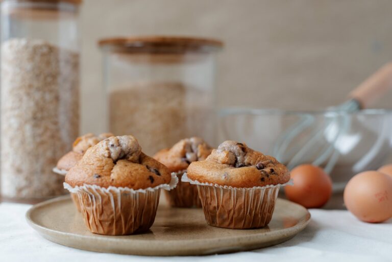 yummy homemade muffins near ingredients on table