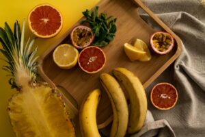 composition of exotic fruits with wooden tray